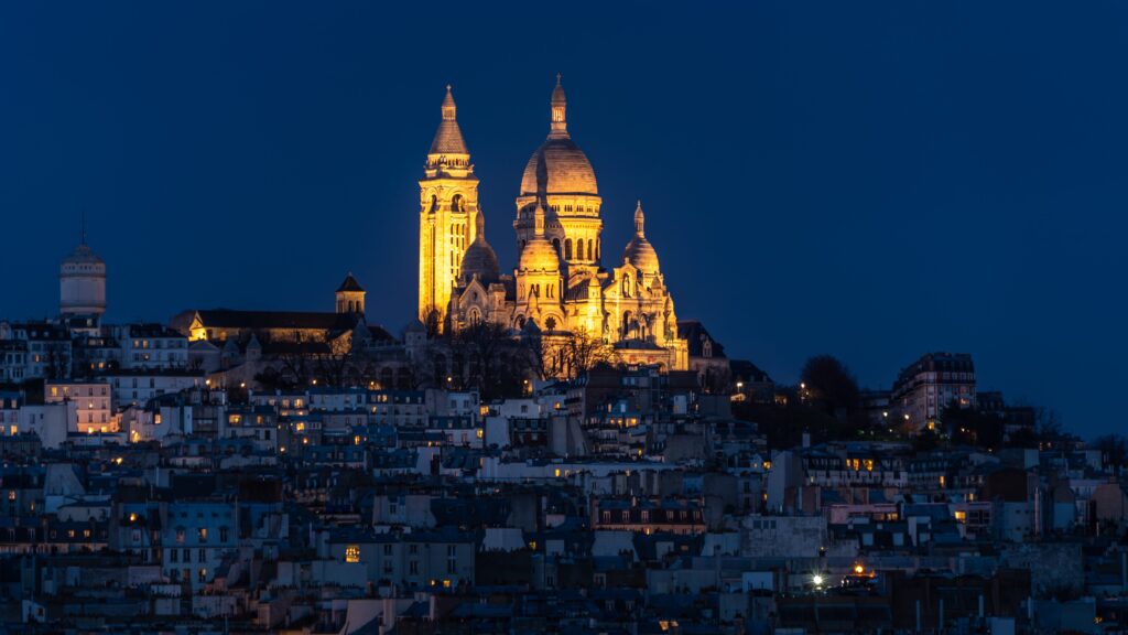 Experience the bohemian charm of Montmartre in Paris. Cobblestone streets, artistic enclaves, and the iconic Sacré-Cœur Basilica create a picturesque tapestry, inviting you to explore the cultural heart of the City of Light.